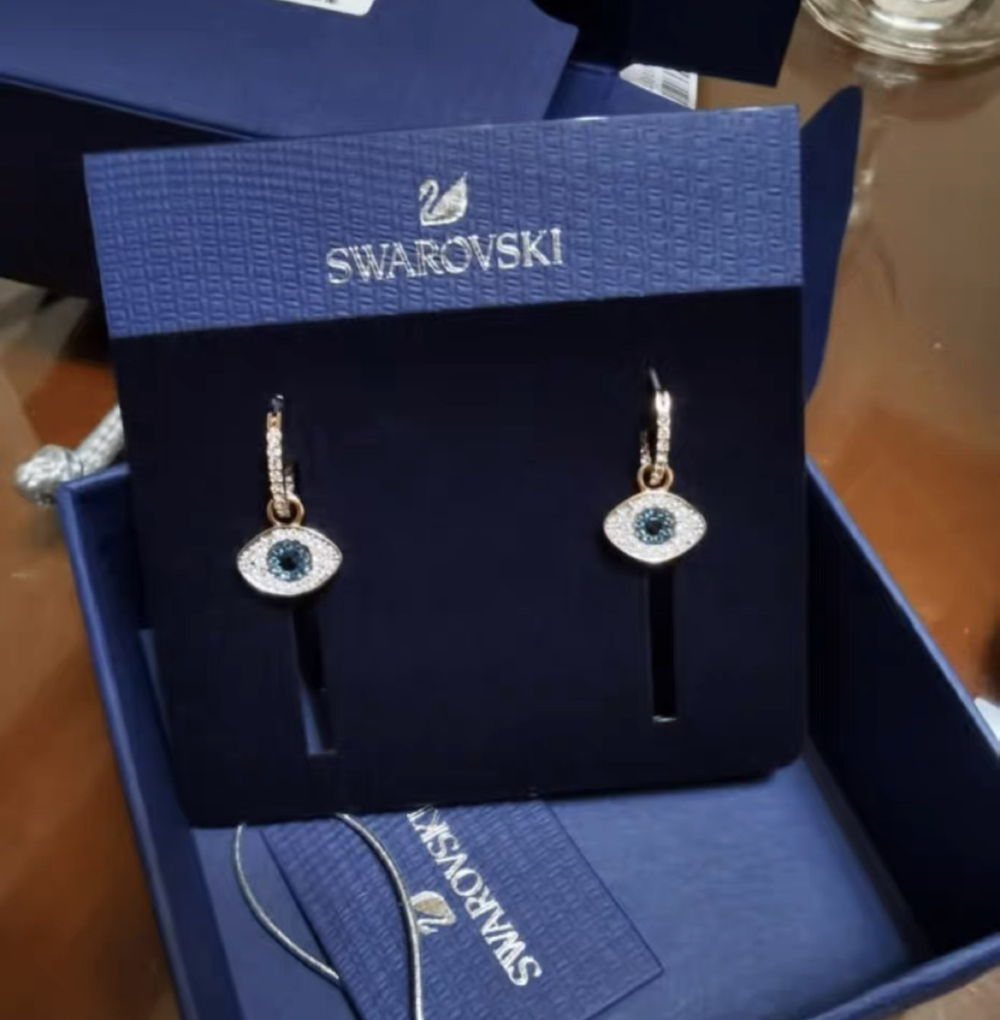 Brand new Swarovski evil Evil eye two way earrings