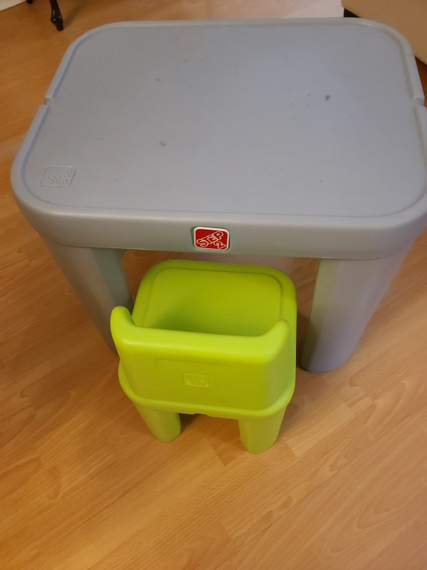 Step 2: Plastic gray table and one green chair