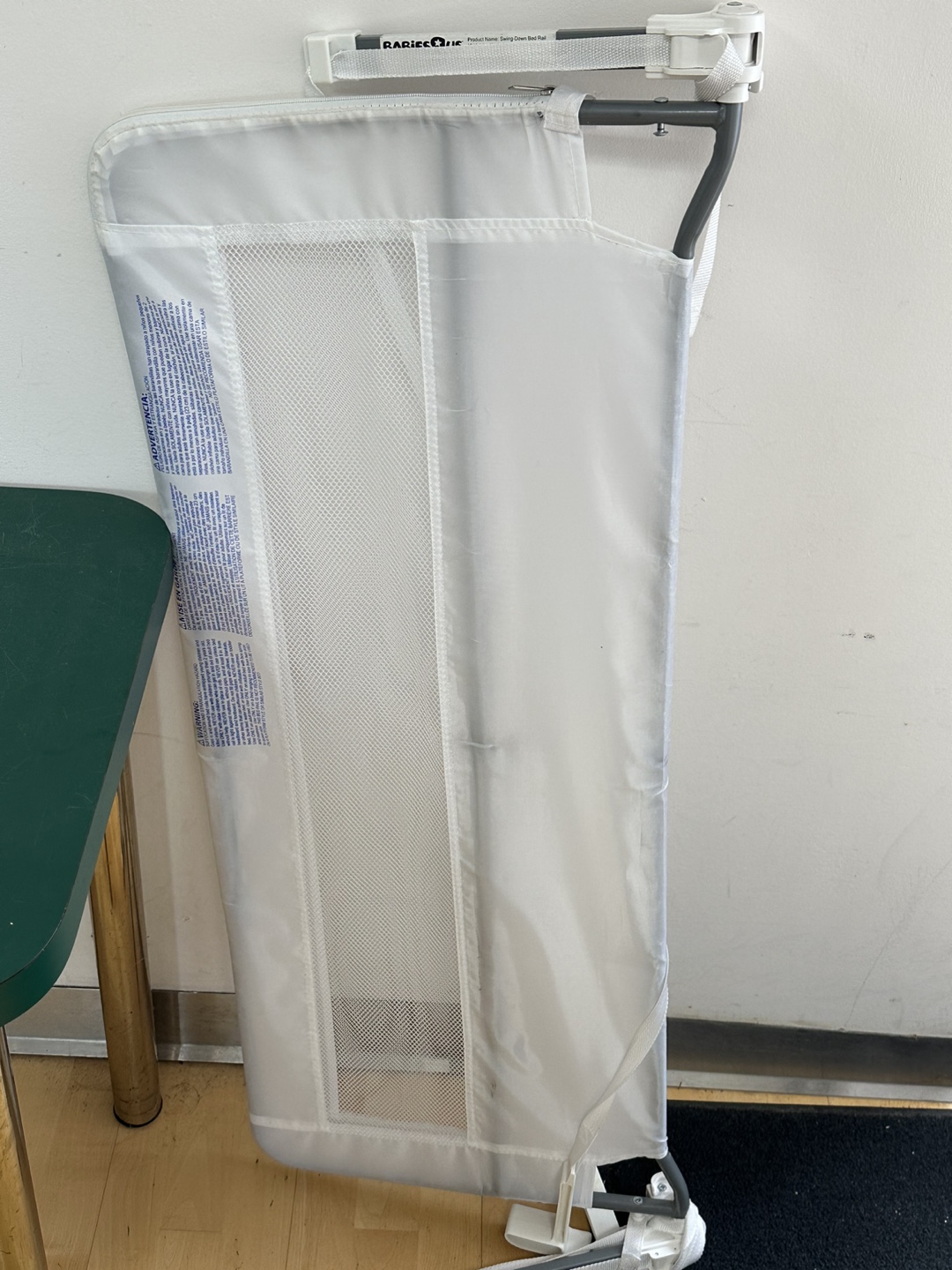 Swing down bed rail