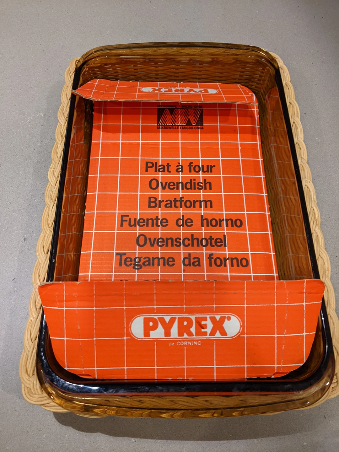 Pyrex dish with matching decorative basket thumbnail