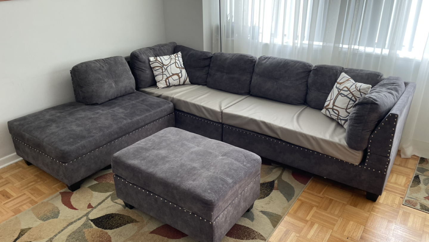 Gray sectional with area rug thumbnail