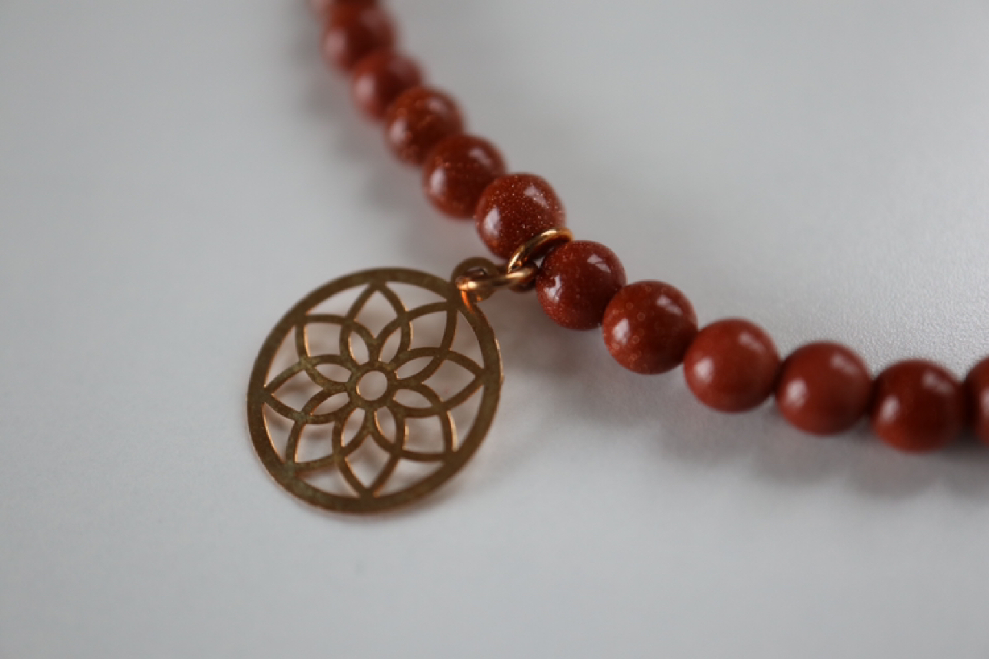 Delicate bracelet with golden figures - photo 2