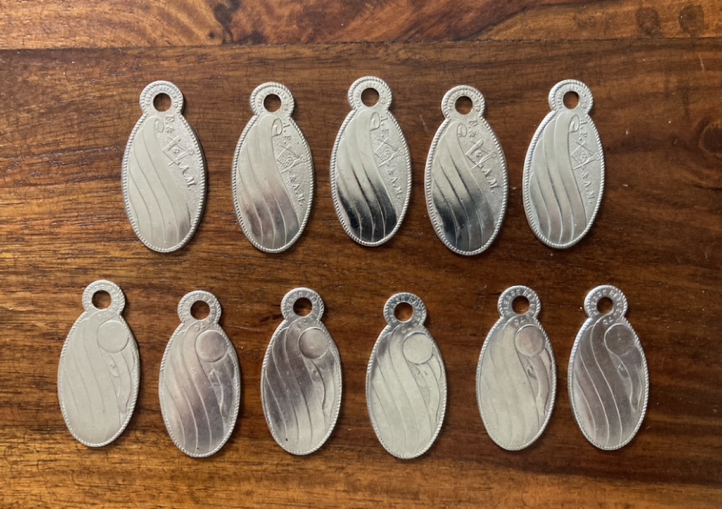 Grouping of 11 vintage dog tags for making jewellery thumbnail