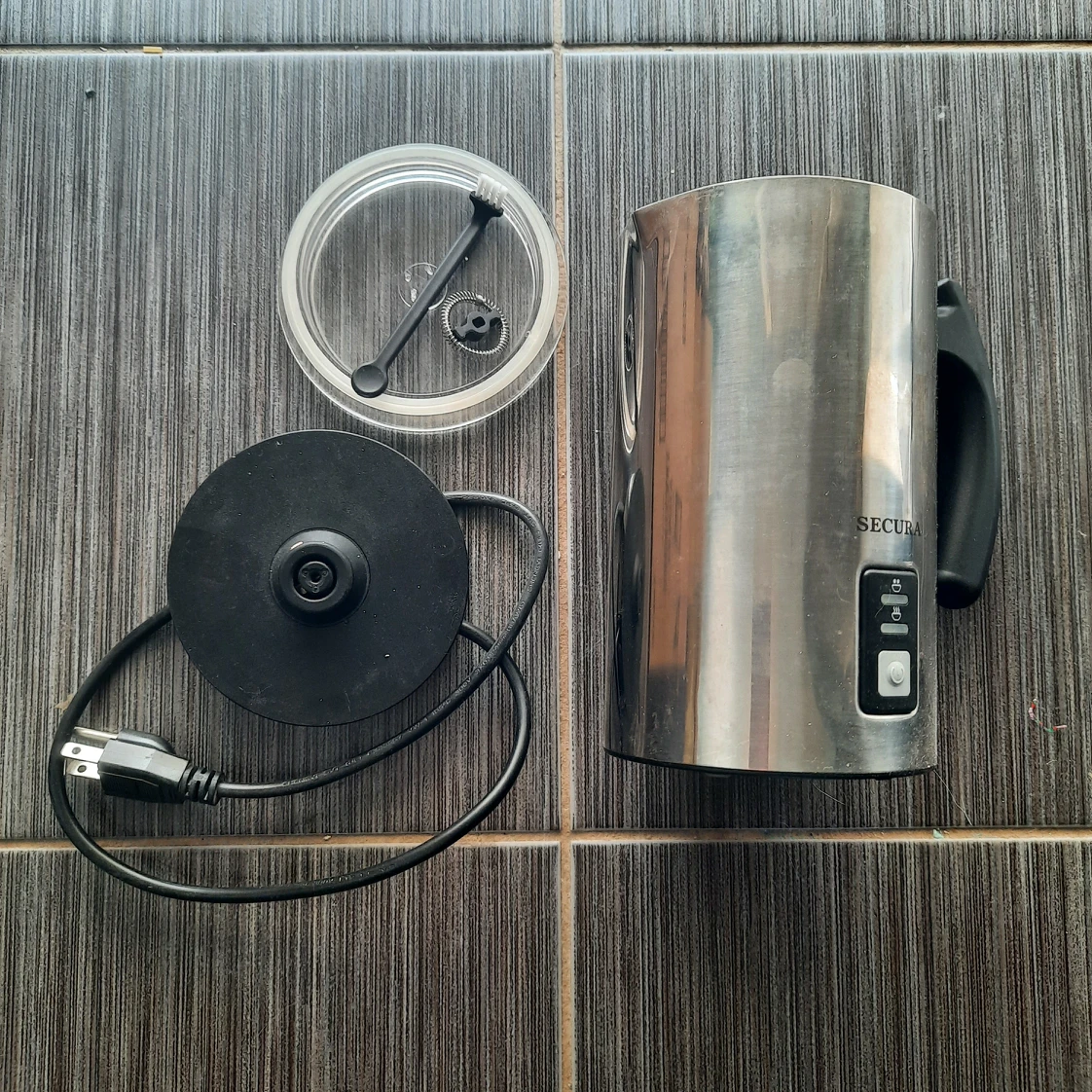 Electric milk frother and heater thumbnail