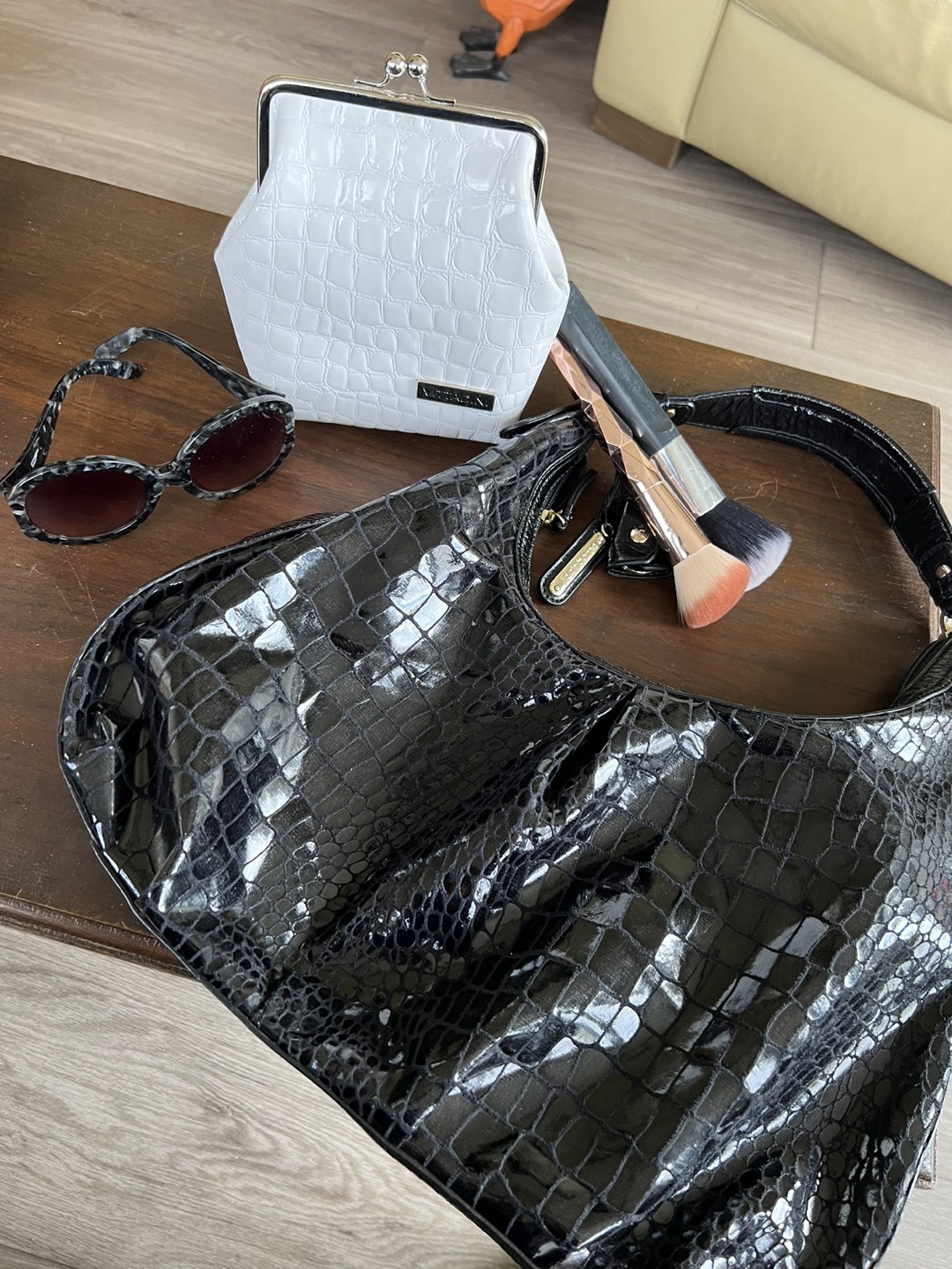 Purse.  Makeup bag. Brushes and sunglasses thumbnail