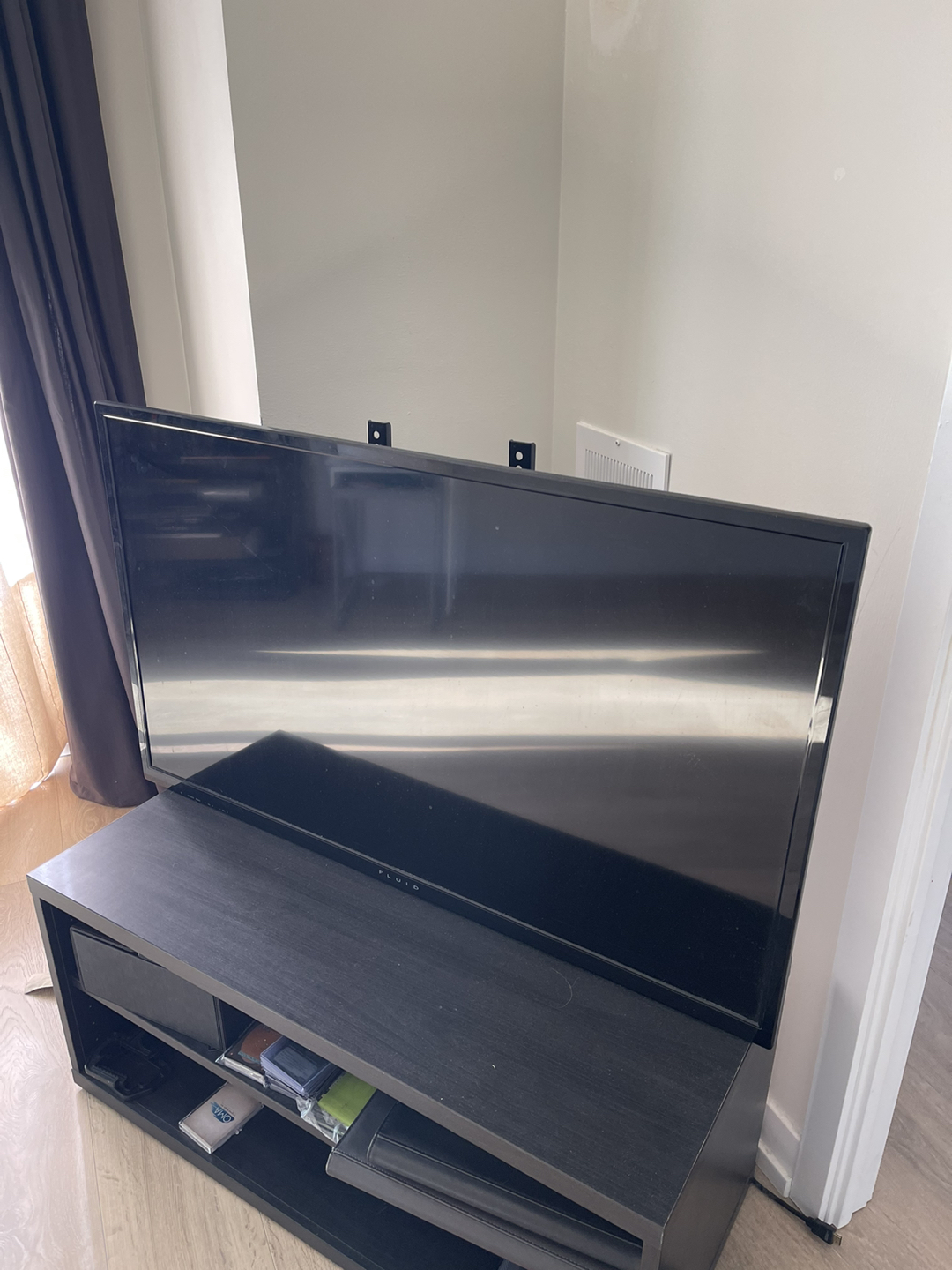 42” Fluid Brand TV and TV stand.