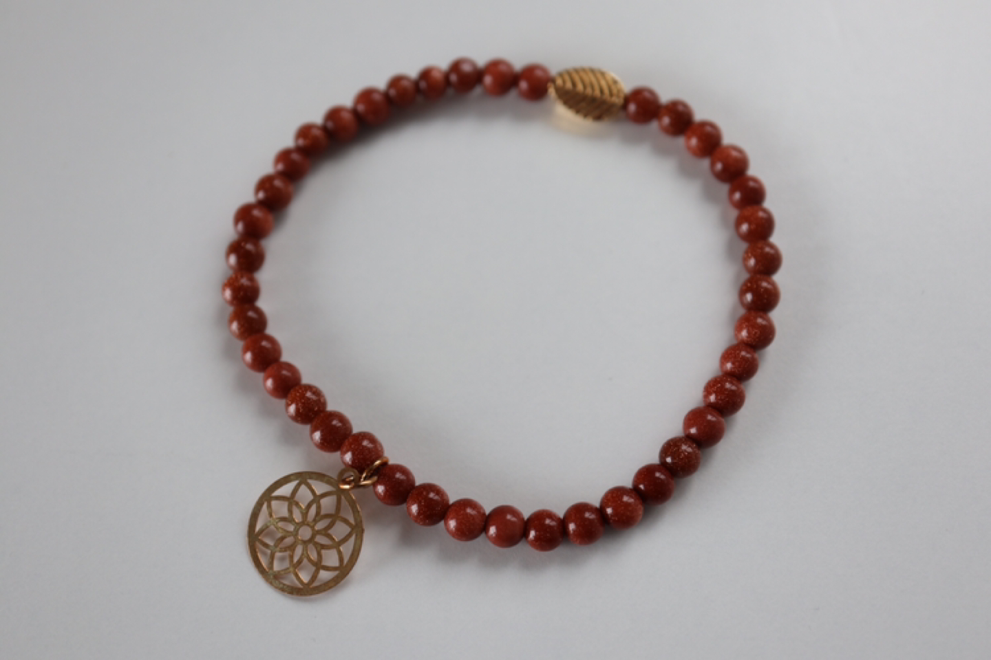 Delicate bracelet with golden figures - photo 4