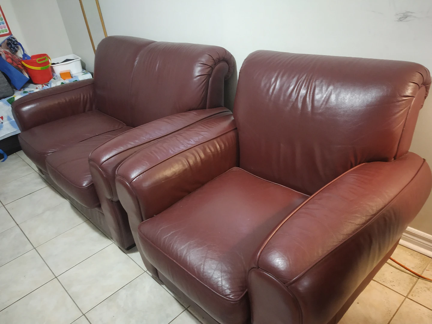 Maroon sofas made from genuine leather