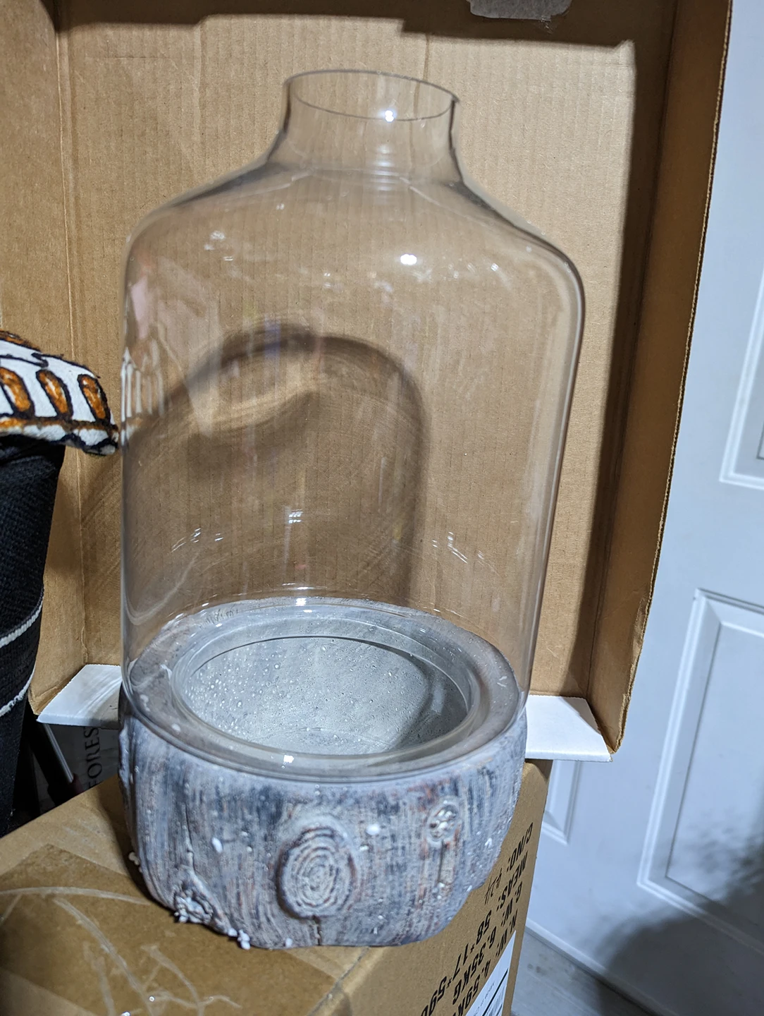 Glass pot with stone base