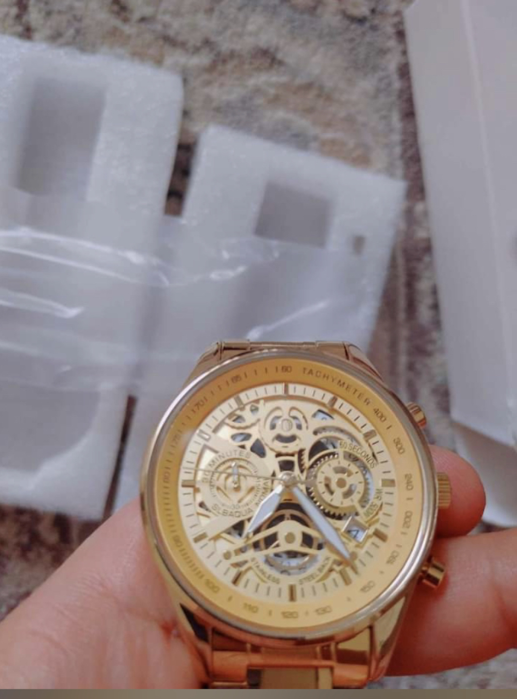 Men’s gold watch thumbnail