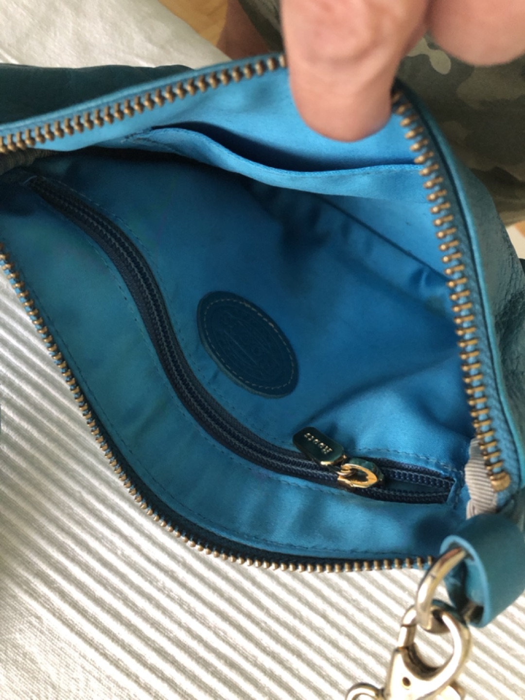 Small turquoise ROOTS purse image indicator(2)