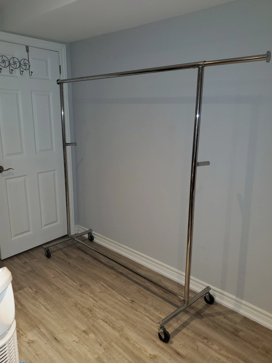 Sturdy metallic clothes rack on wheels