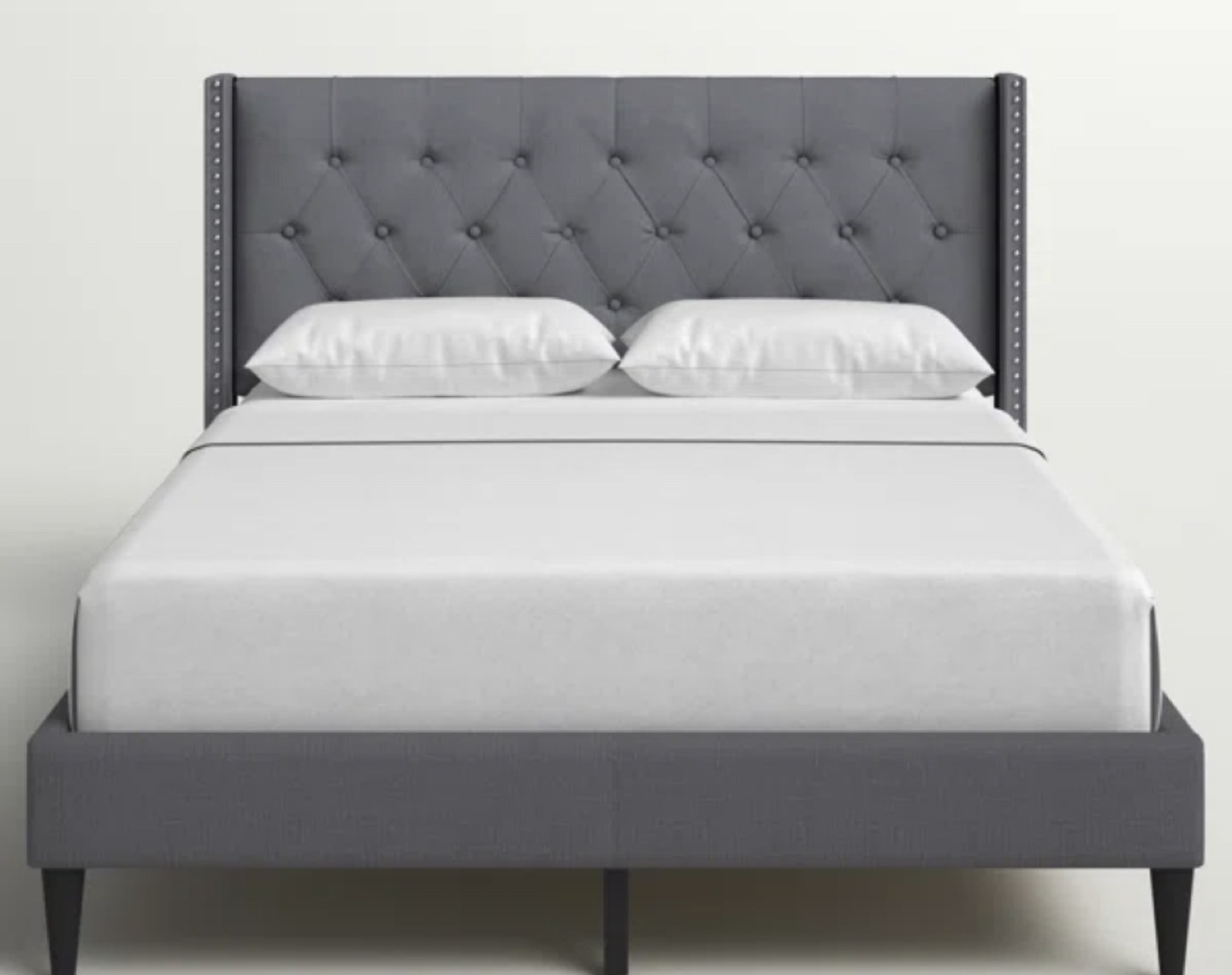 Tufted grey bed