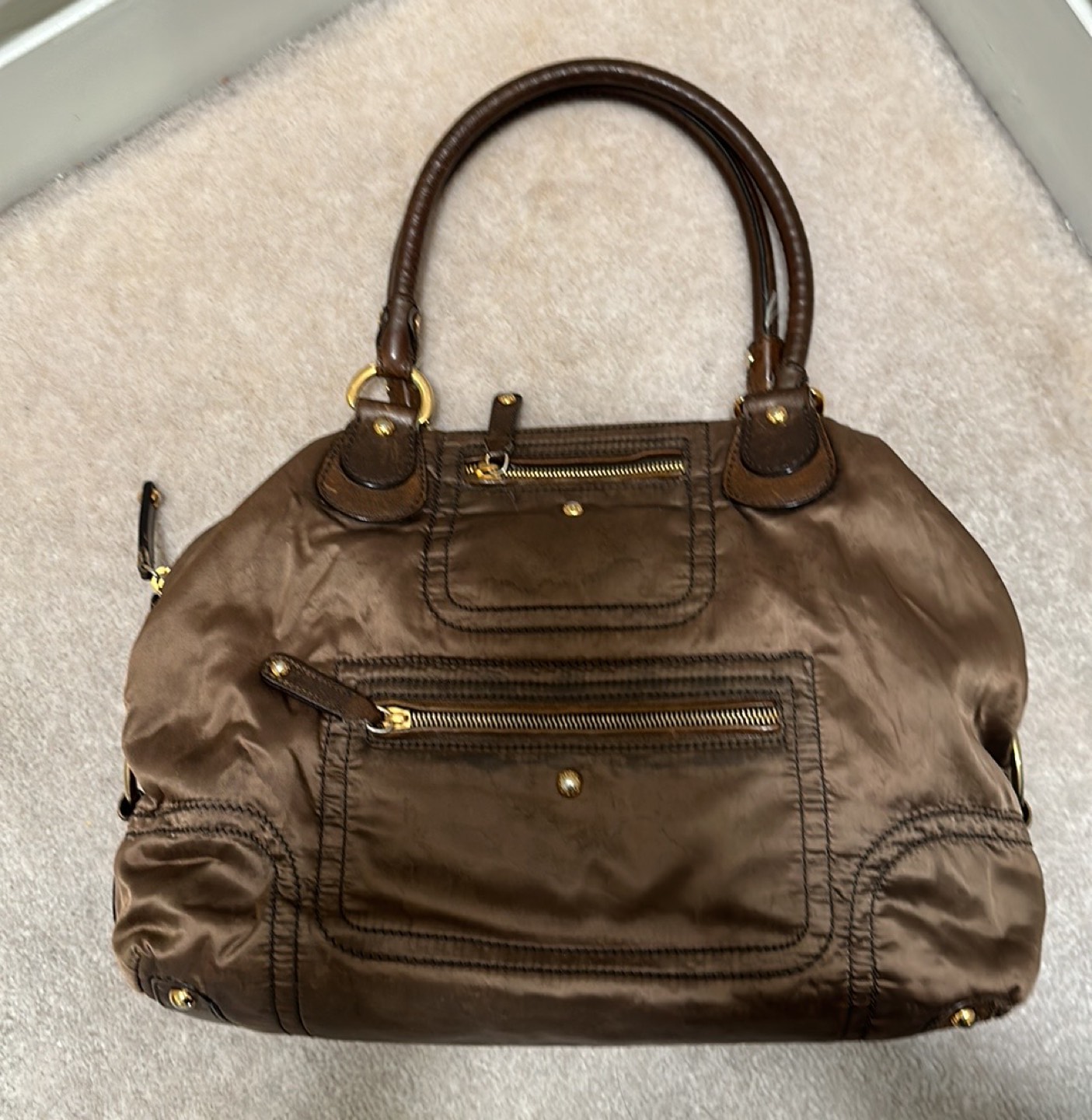 Tod’s used authentic leather trimmed tote in olive green