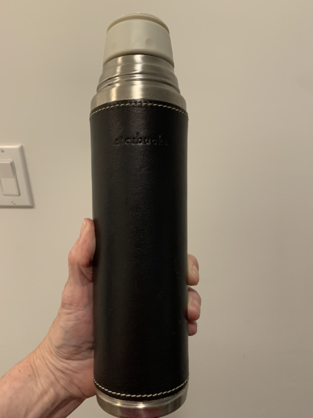 Starbucks thermos with faux leather sleeve