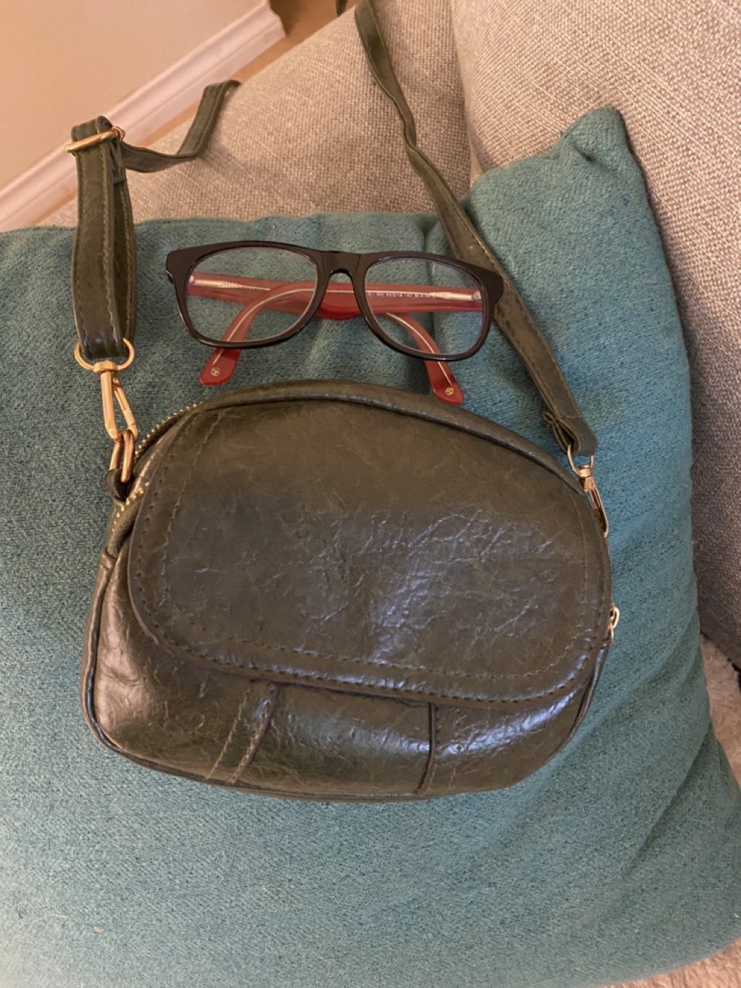 Green leather purse. Glasses for size thumbnail