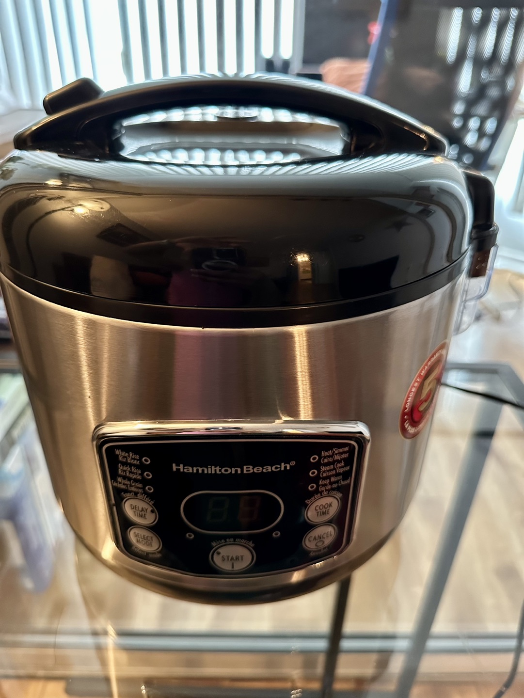 Rice cooker with steaming basket