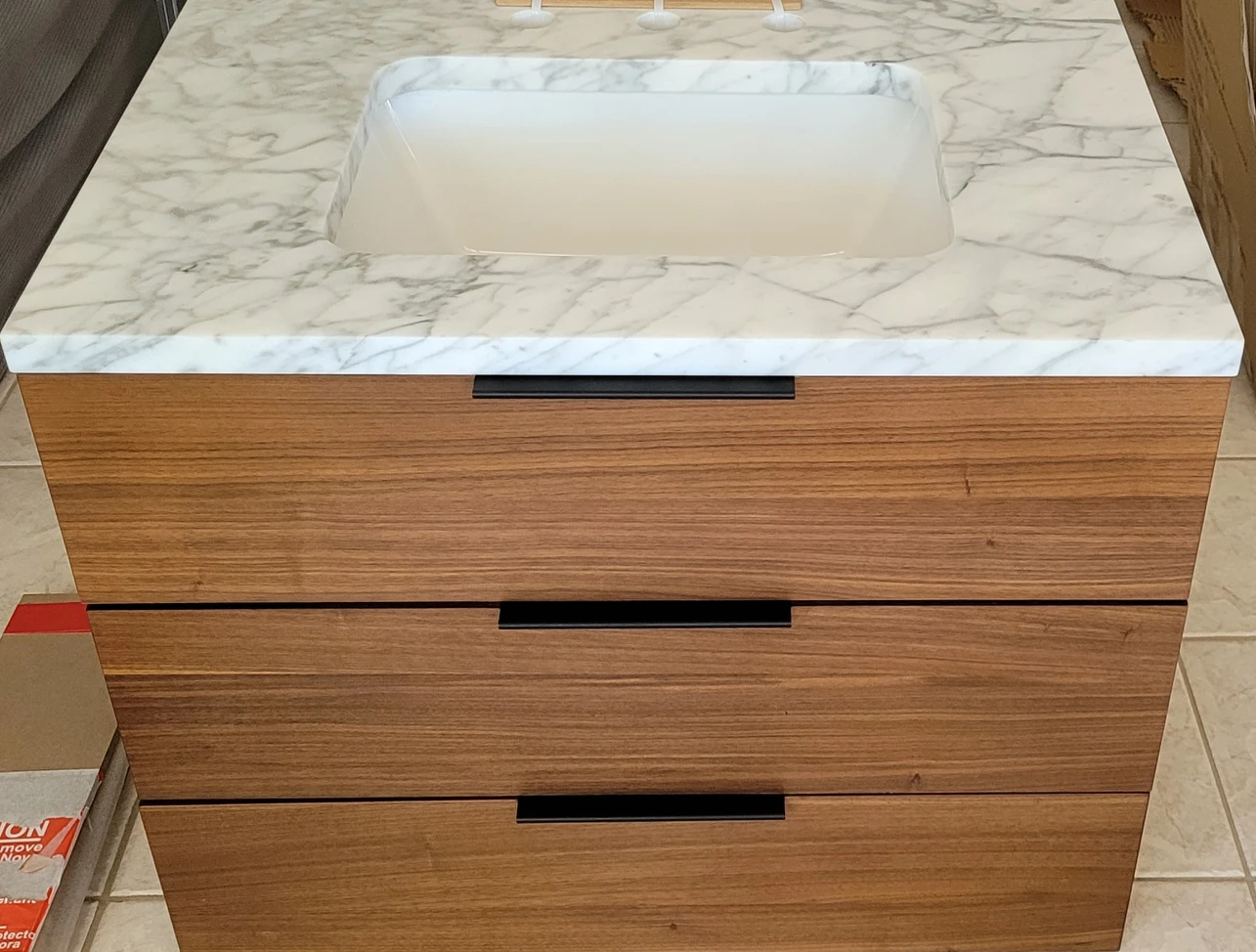 30 inch new vanity with Carrara marble top.
