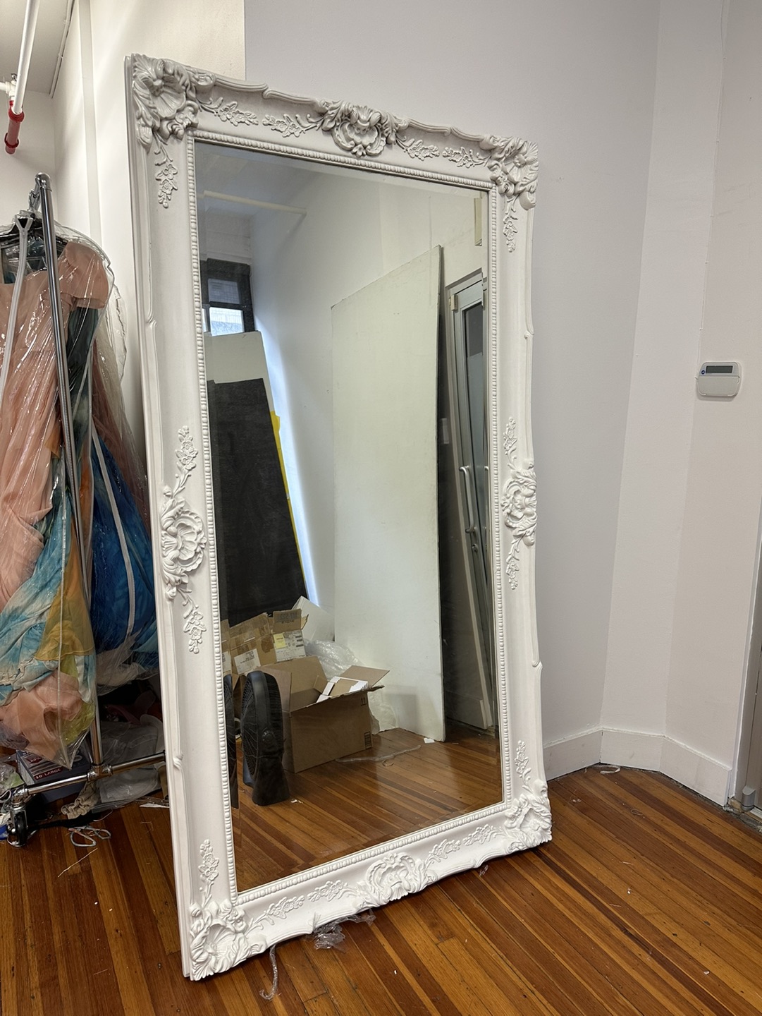 Large ornately framed full length mirror