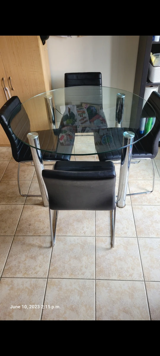 Glass dining table set with 4 chairs.