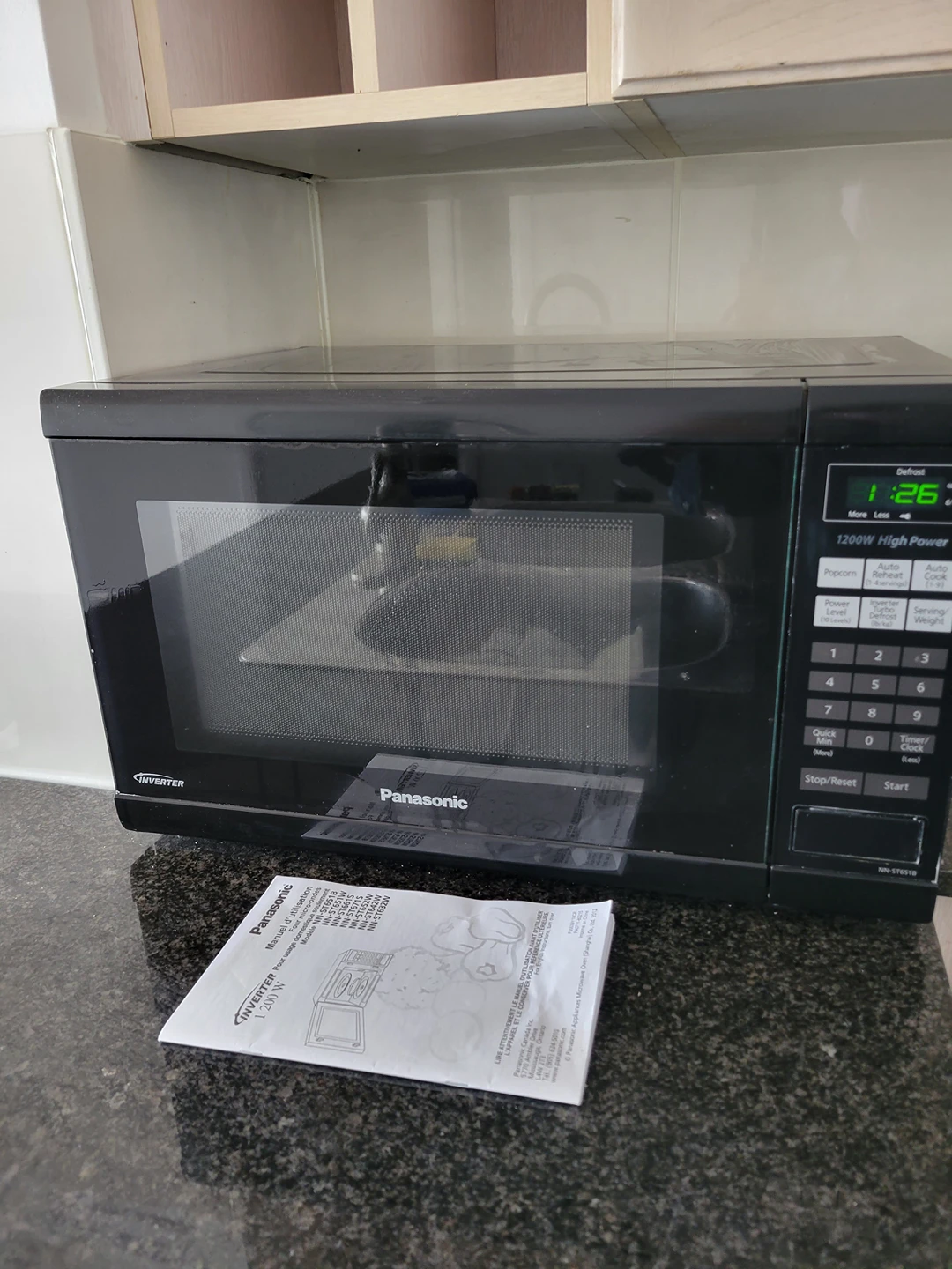 black Panasonic microwave with manual thumbnail