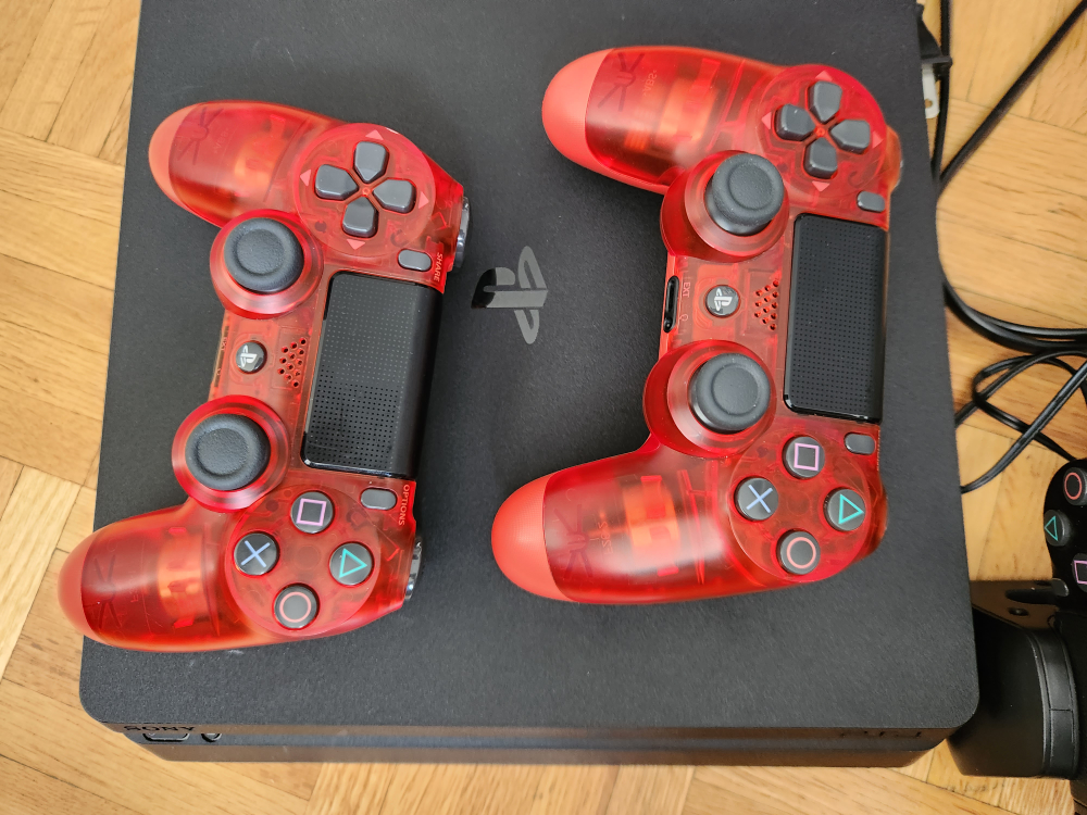PS4 with 4 controllers and charging stand. - photo 3
