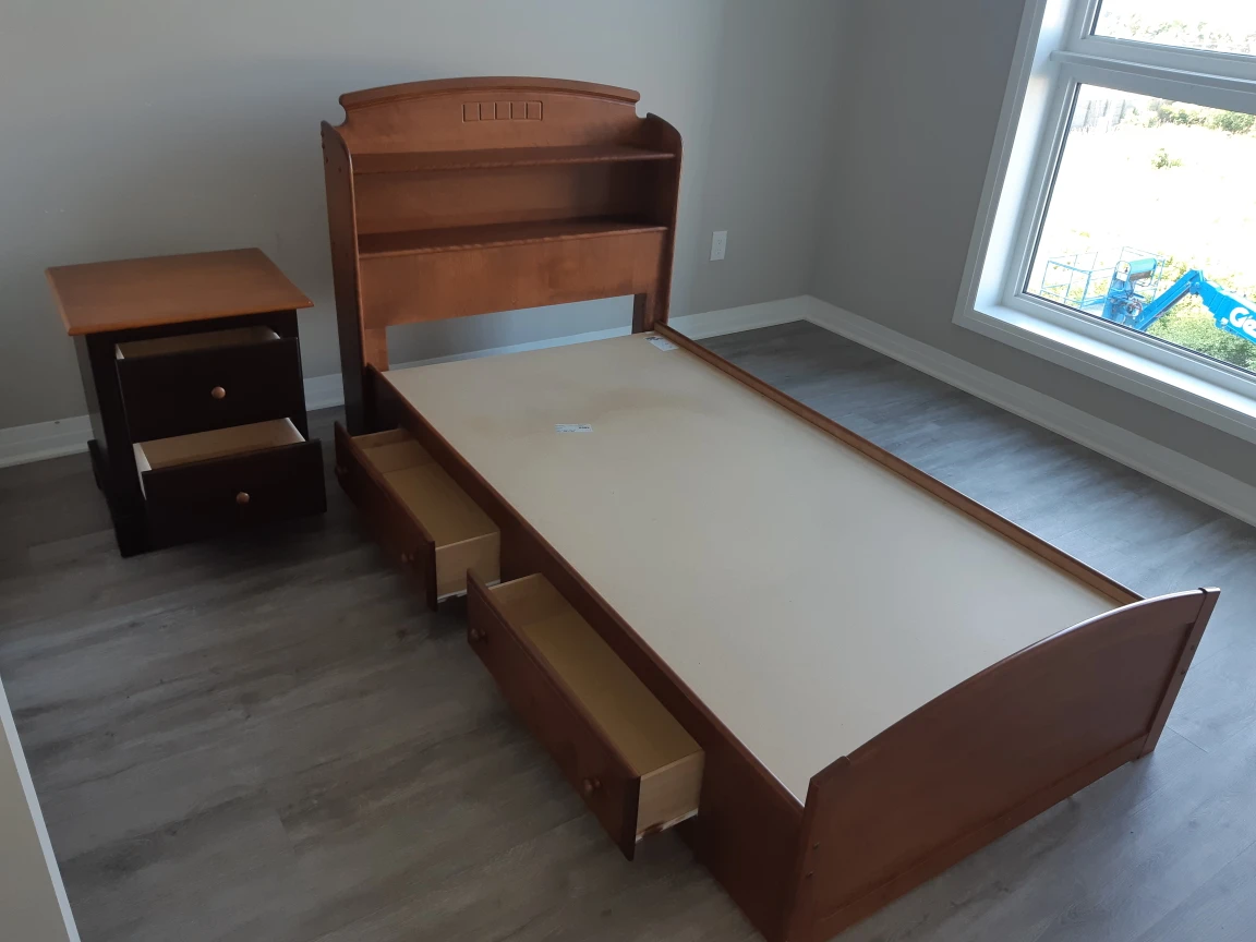 Wooden twin bed with drawers, bookcase and nightstand