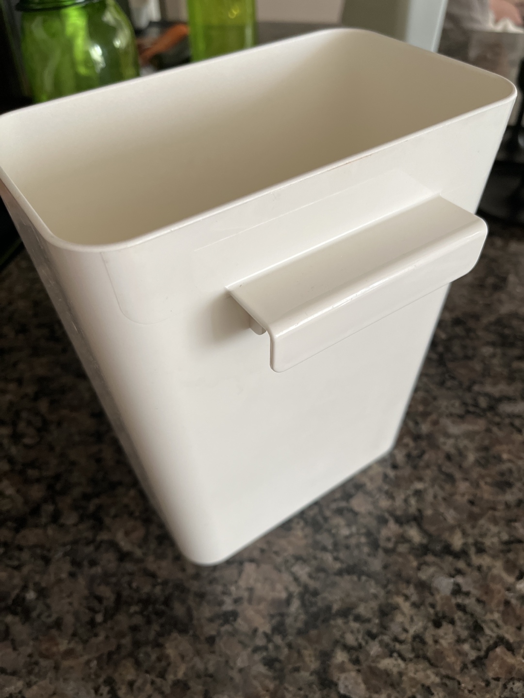 Container with a long handle thumbnail