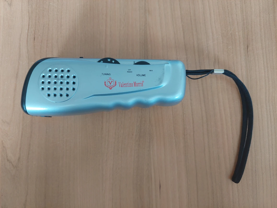 Camping essential flashlight with radio and siren