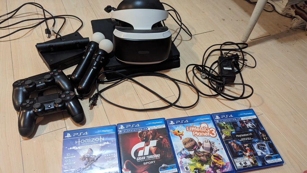 PS4 Slim and PSVR w/2 controllers, move
controllers, and games! thumbnail