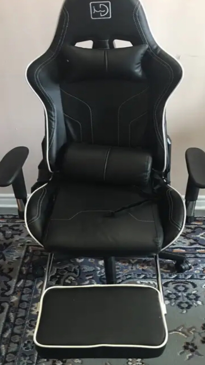 gaming chair with a high back and footrest thumbnail