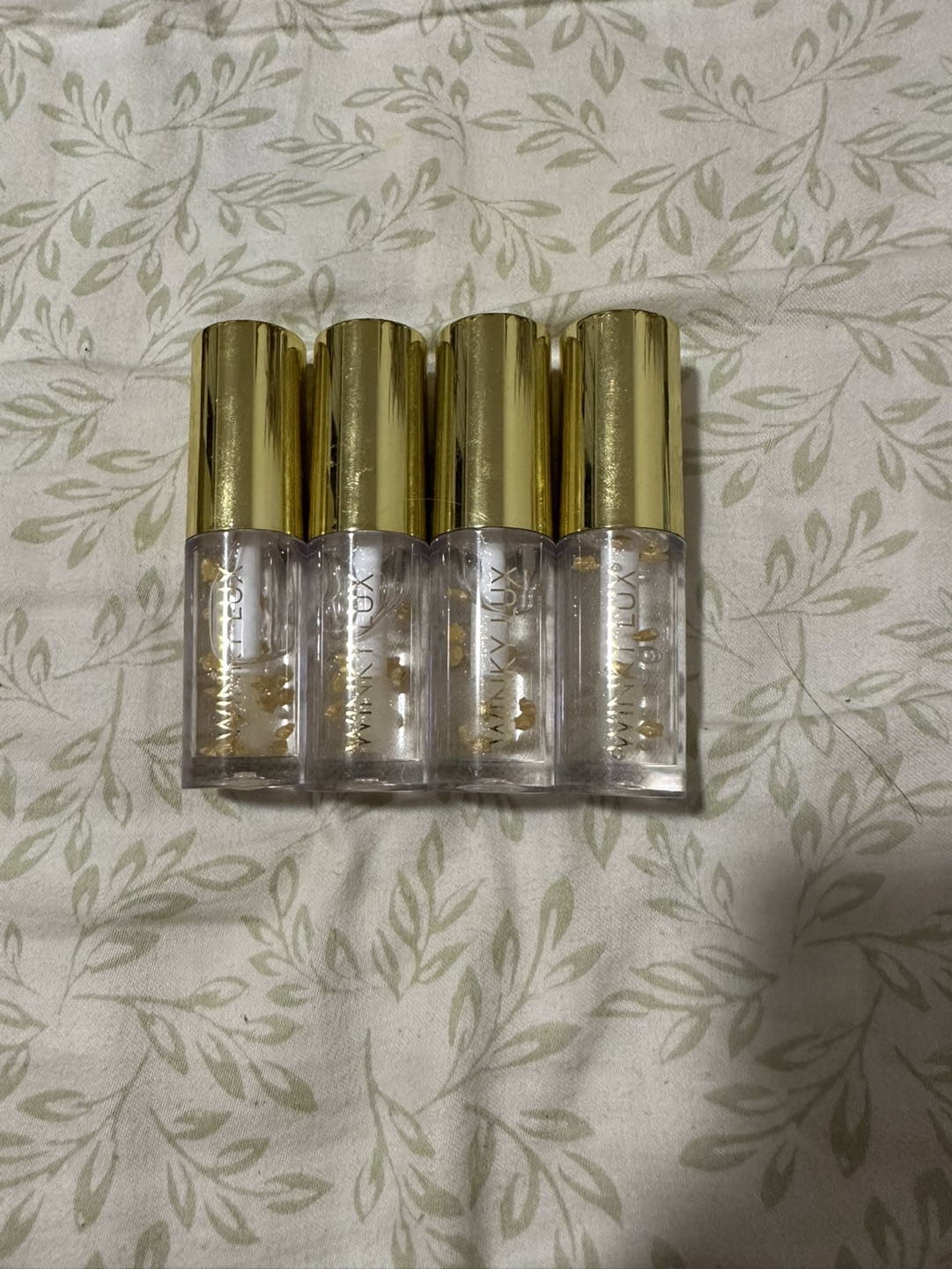 Lip Oil with Golden Sparkles and Stars