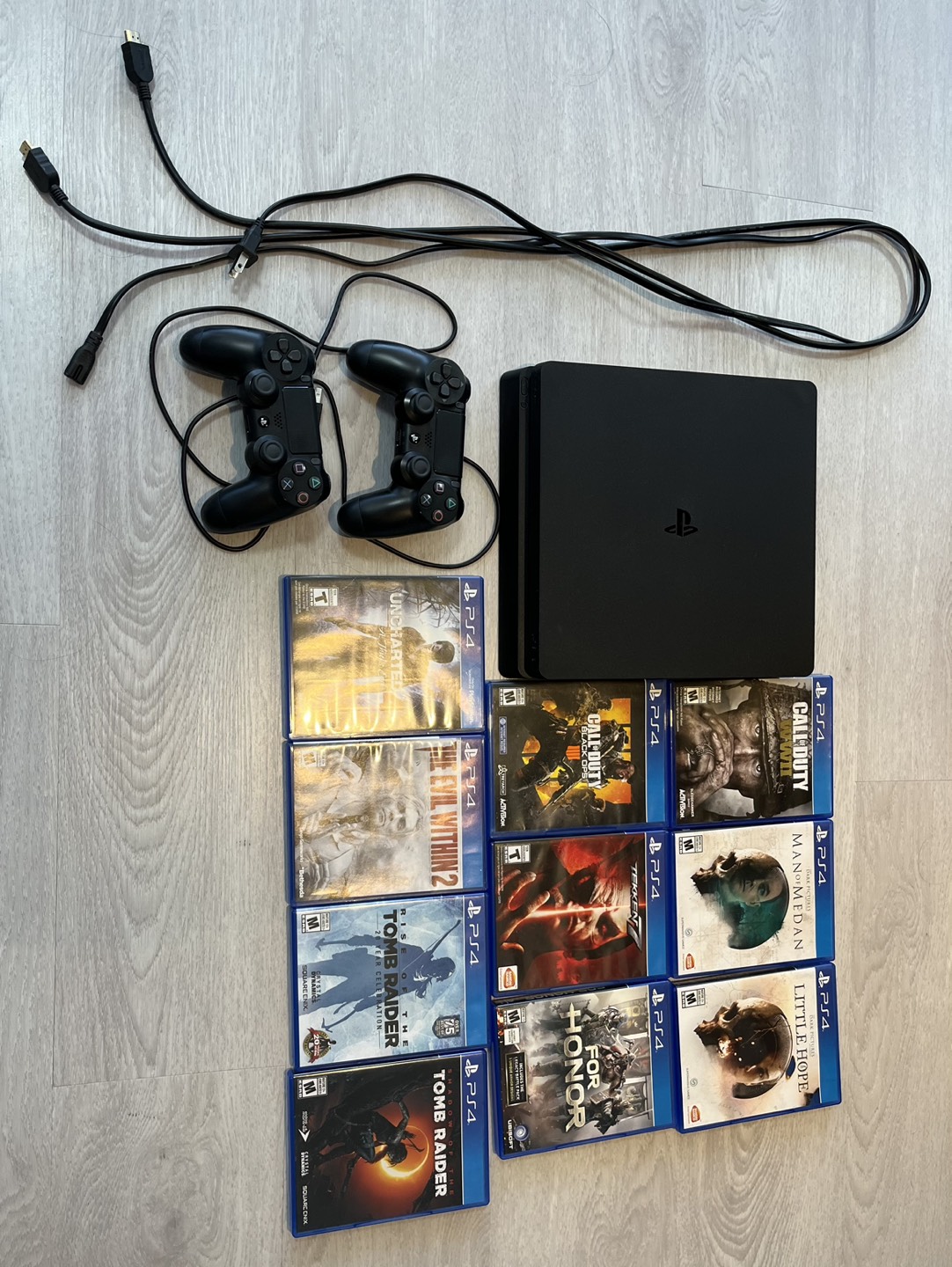 PS4 Slim Black with 2 Controllers and 10 Games thumbnail