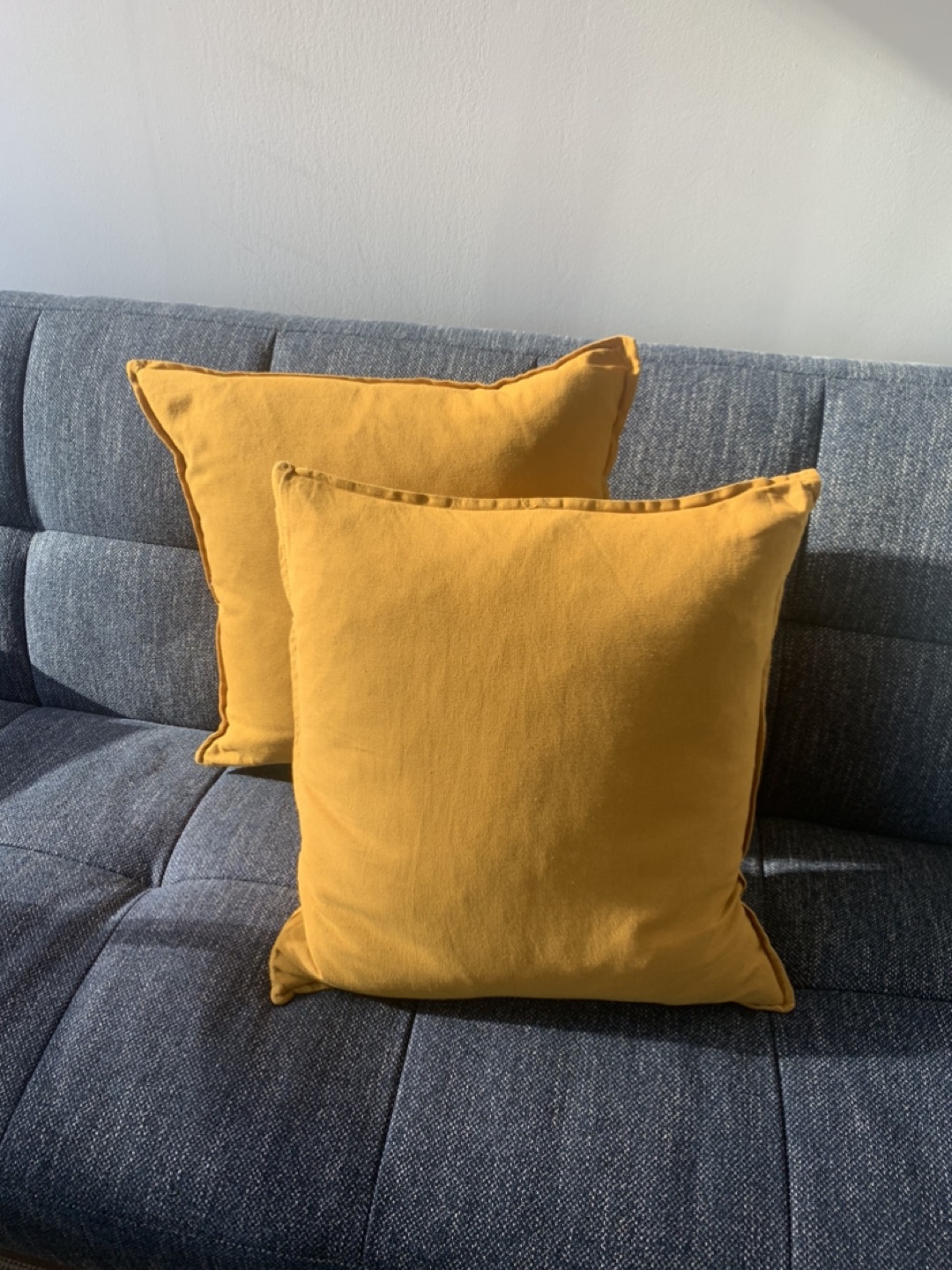 2 mustard cushions
