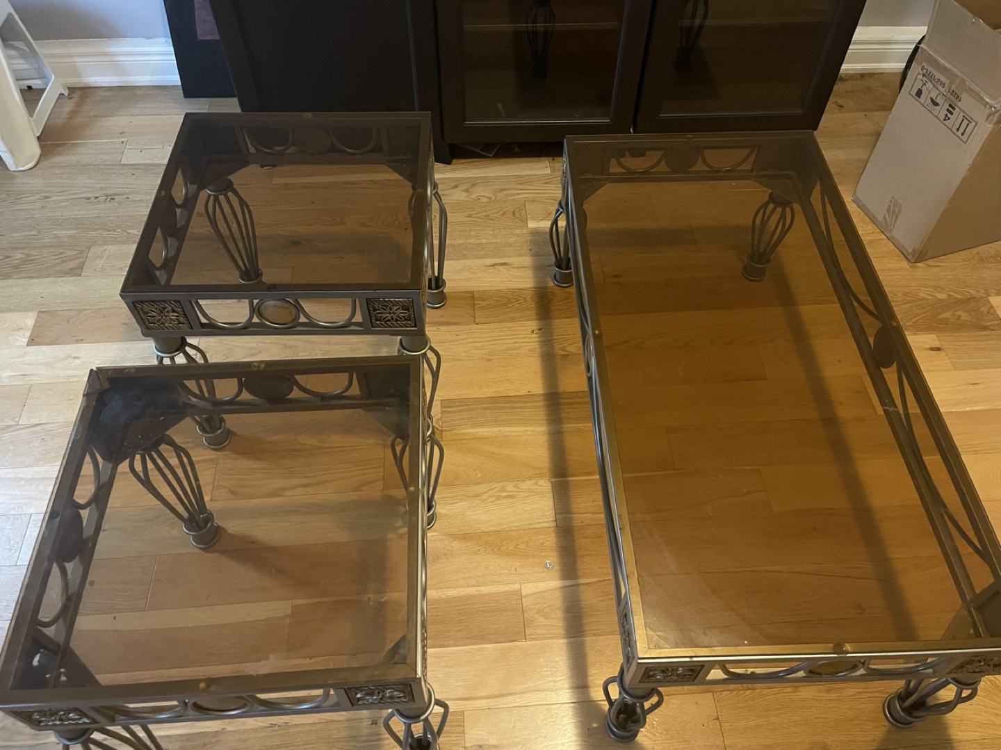 Three piece glass coffee table and side tables