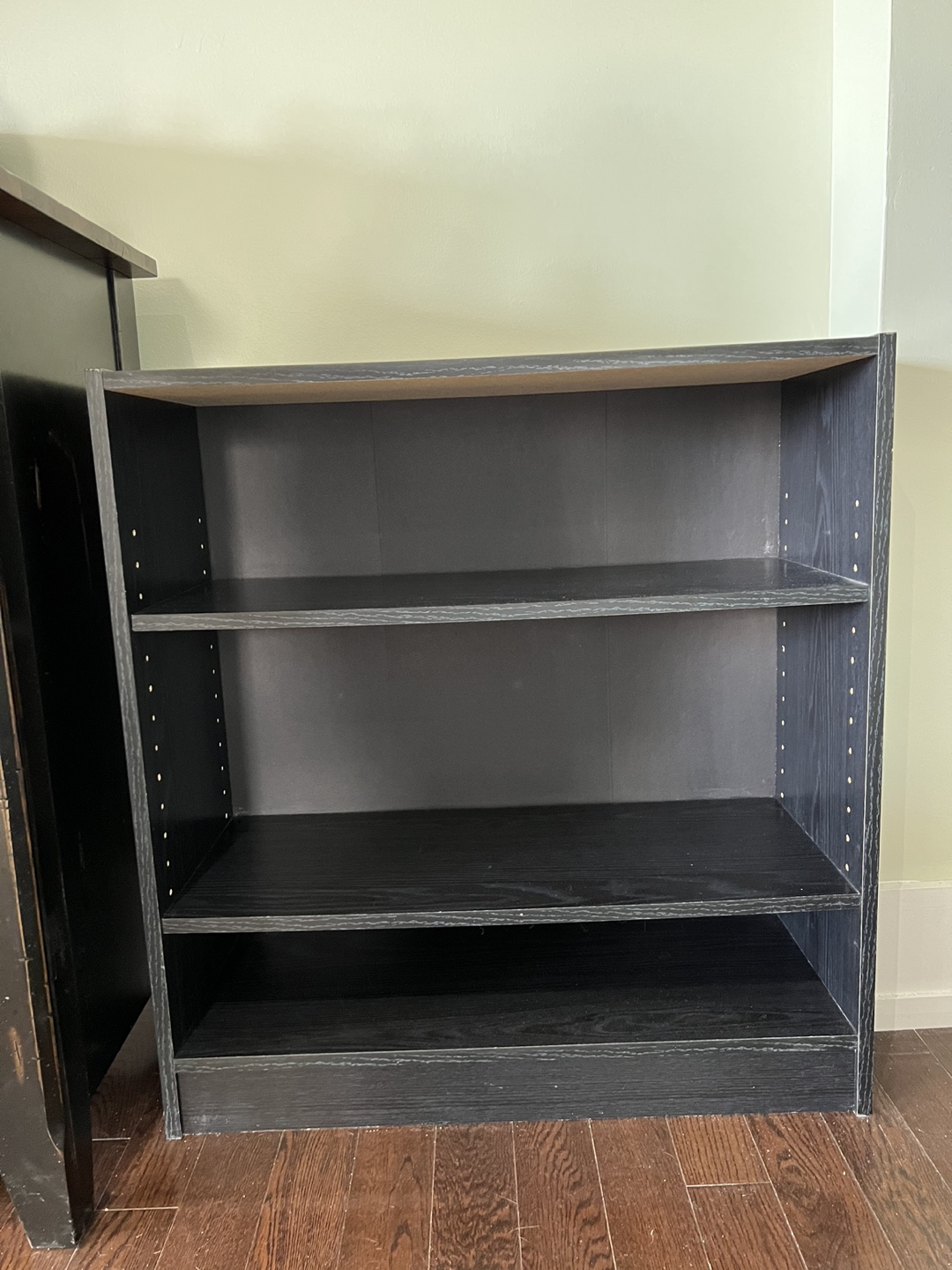 Sturdy black bookcase with three shelves