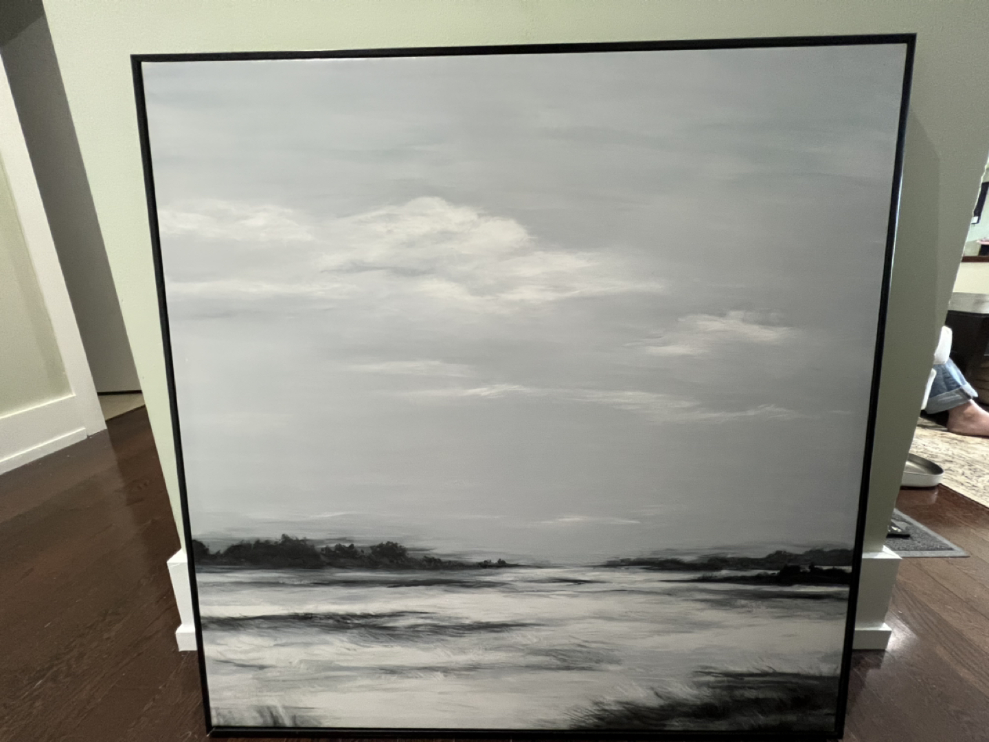 Framed canvas painting of a lake