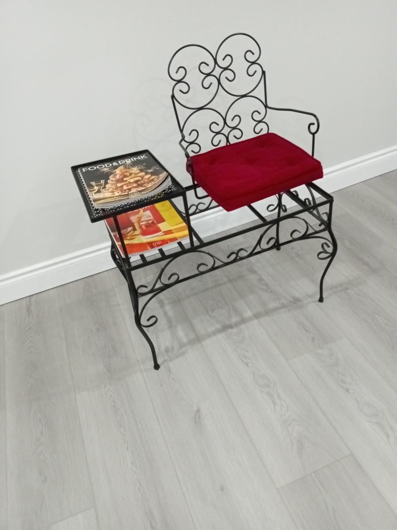 vintage telephone and magazine stand