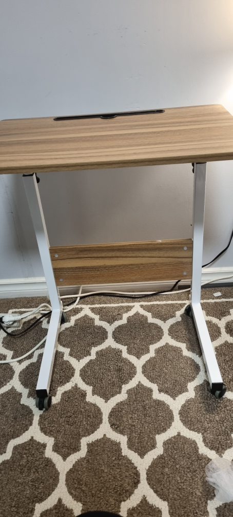 Adjustable mobile bed table