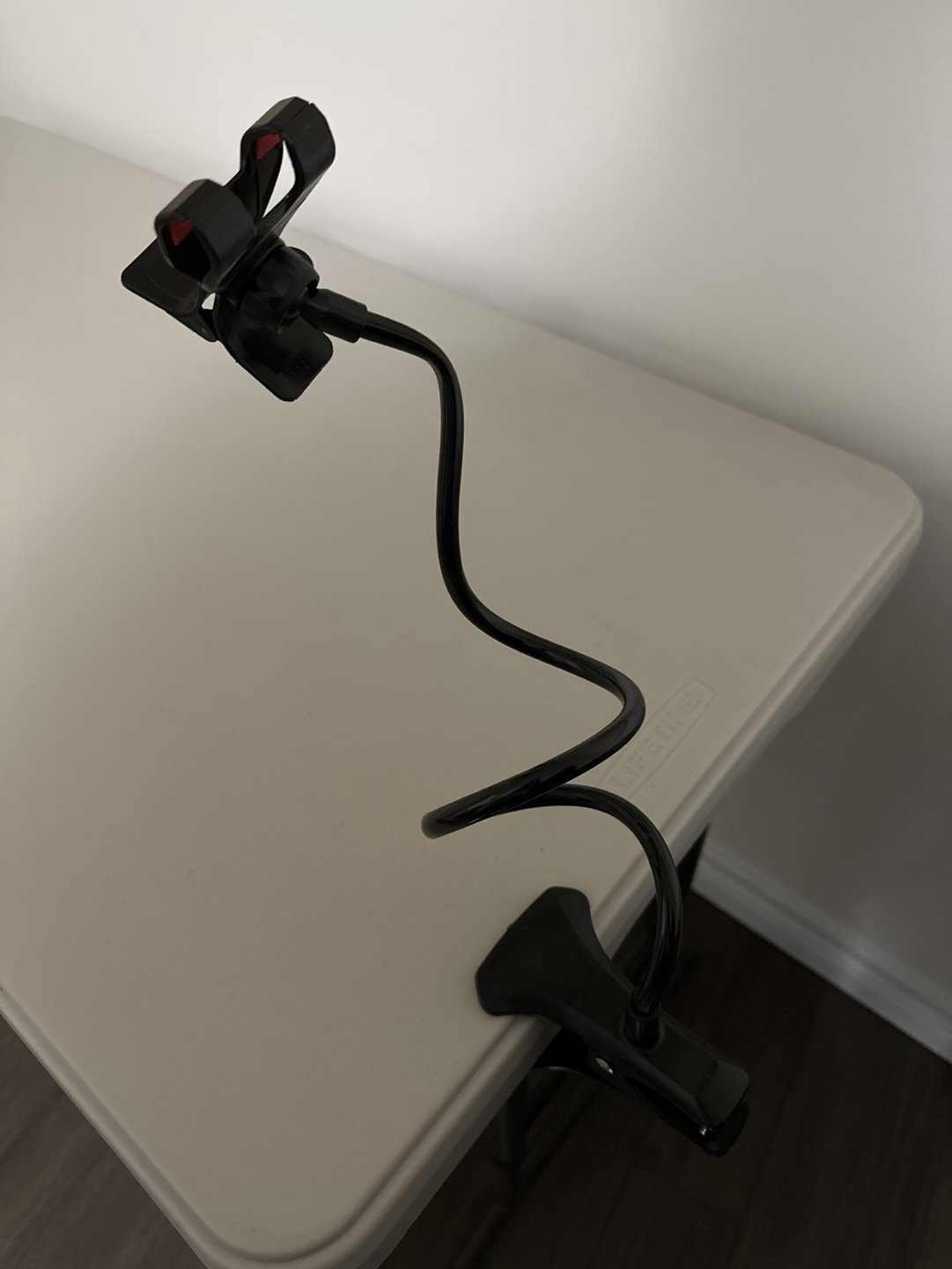 Phone holder with clamp adjustable