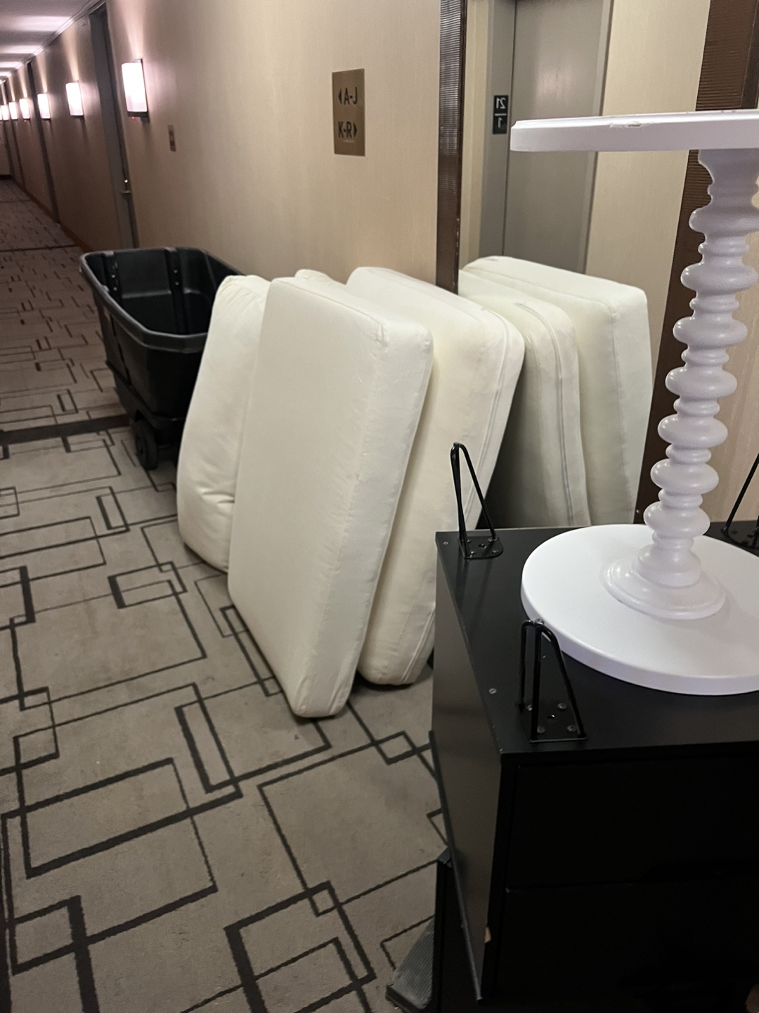 A long white couch already disassembled barely used