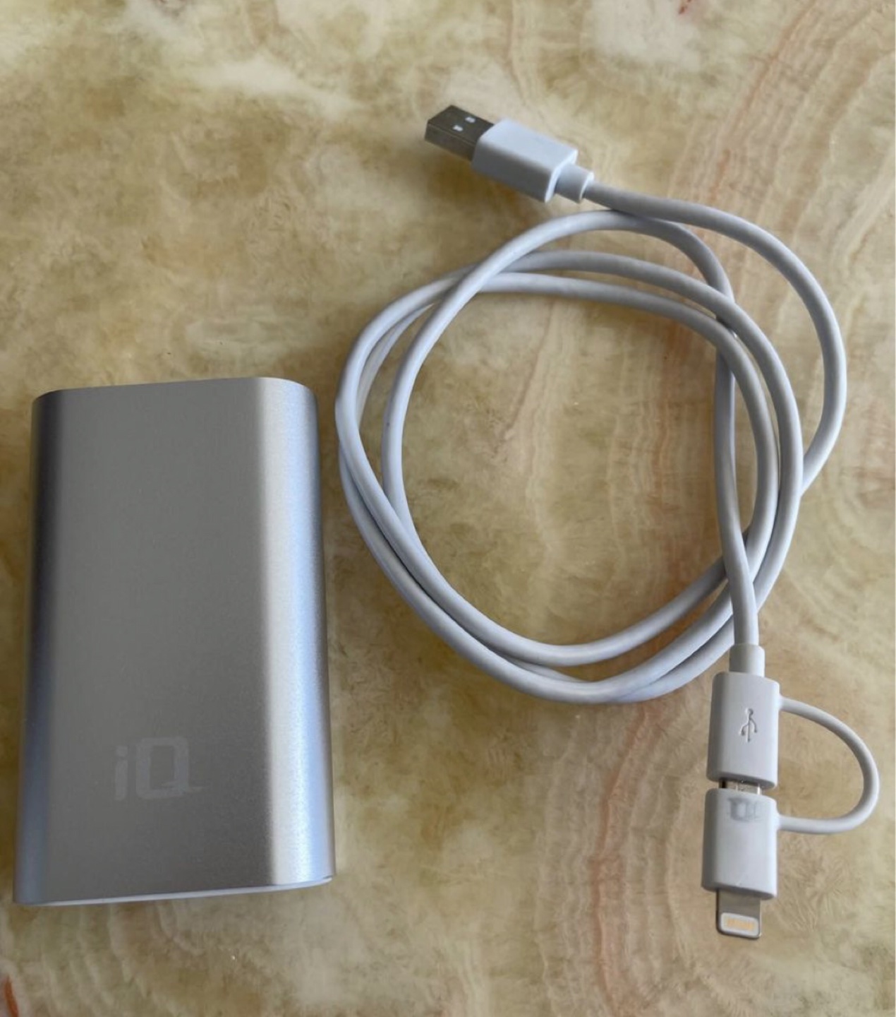 Power bank in silver comes with cable