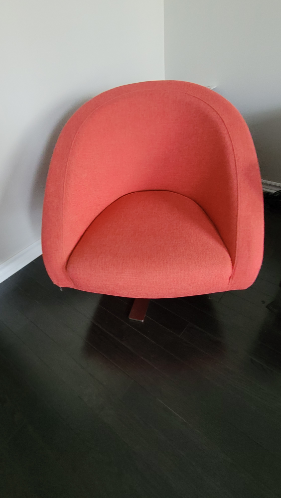 Red swivel accent chair