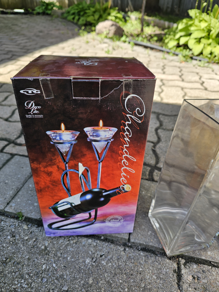 candle and wine bottle holder with candles