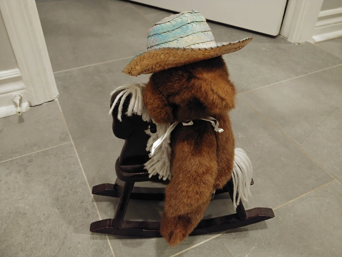 Toy rocking horse with teddy bear
