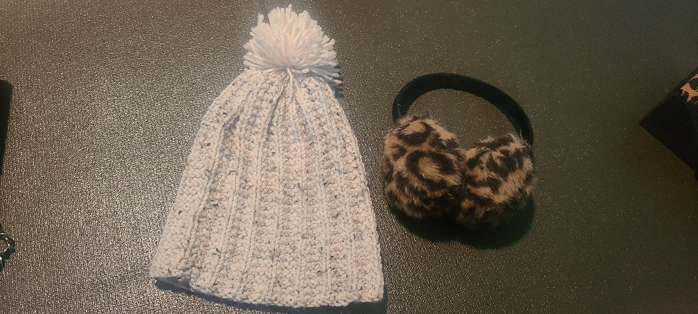 White winter hat and earmuffs