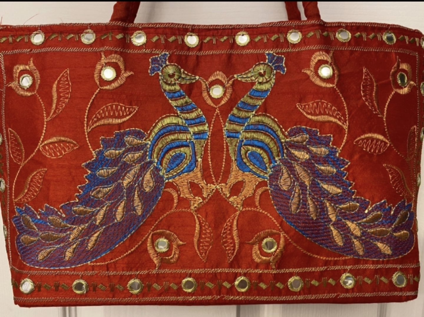 Red bag with peacock design image indicator(2)