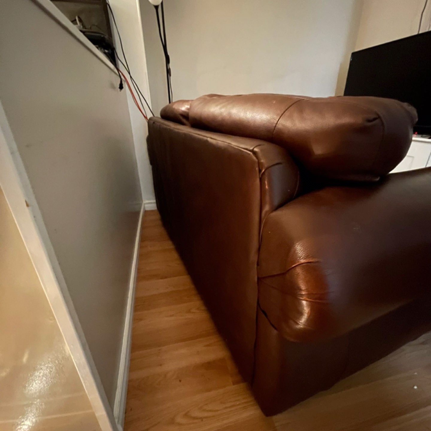 Two seater leather couch - $100 - photo 2