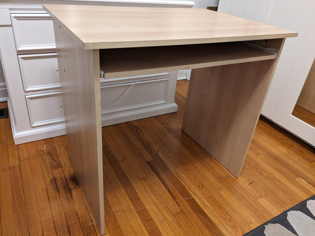 Desk with rollout shelf