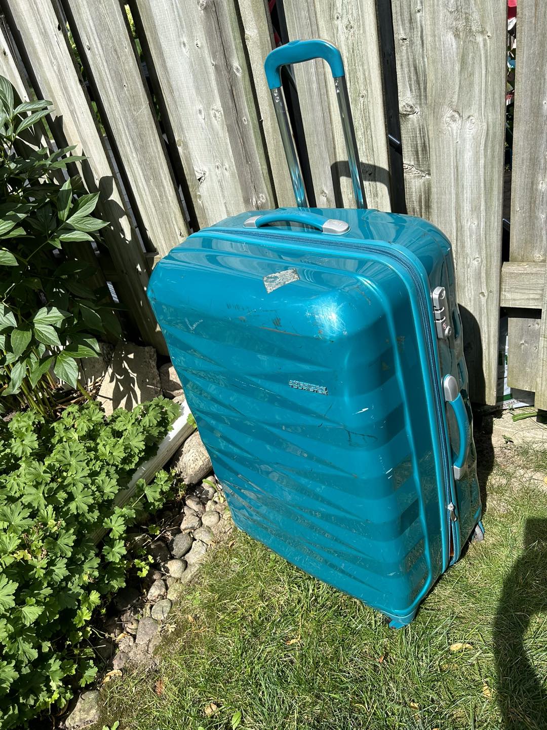 American tourist luggage thumbnail